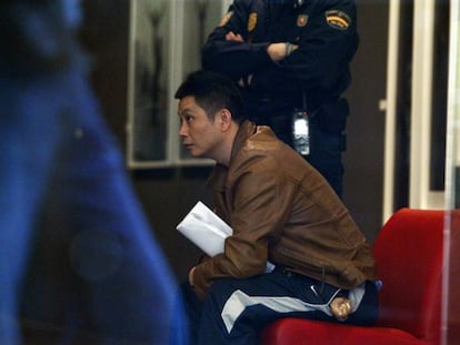 Gao Ping, pictured during the police raid on his Madrid art gallery last week.