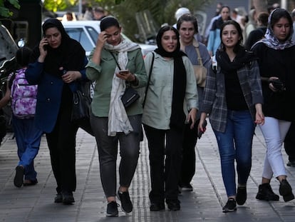 Iranian women, some without wearing their mandatory Islamic headscarves, walk in downtown Tehran, Iran, Saturday, Sept. 9, 2023.