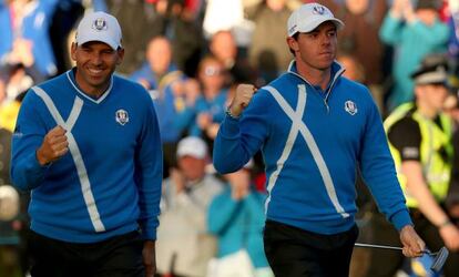 Sergio García y Rory McIlroy celebran un golpe.