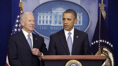 US President Barack Obama delivers a statement on Tuesday after striking a deal to avert a financial crisis, with Vice President Joe Biden at left.