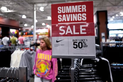 A sale sign is displayed for clothes at a retail store in Vernon Hills