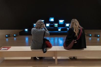 Two women look at the work entitled "Quindío Way", by Colombian artist José Alejandro Restrepo