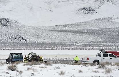 A Care Flight medical transport plane carrying a patient and four others that crashed the day before is seen Saturday, Feb. 25, 2023, in Lyon County, Nev. All five people on board were killed.