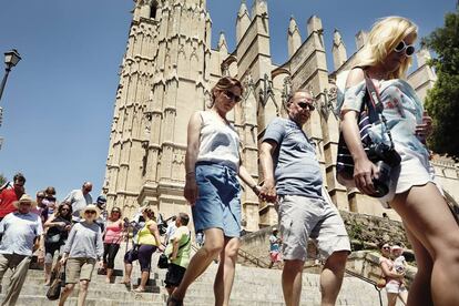 Tourists near the Cathedral of Santa Maria of Palma.