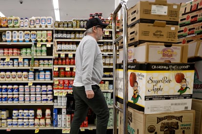 A shopper walks down an aisle at an Albertsons grocery store in Los Angeles, California, USA, 26 February 2024.