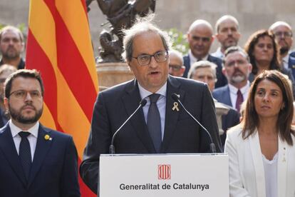 Catalan premier Quim Torra and aides observing the referendum anniversary.