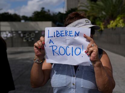 A protester holds a sign that reads in Spanish 'Release Rocio!,' referring to arrested activist Rocio San Miguel, outside office of the UN Development Program in Caracas, Venezuela, Feb 14, 2024.