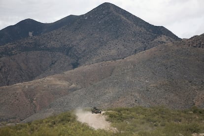 An army vehicle patrols a rural highway in the Mexican state of Sonora.