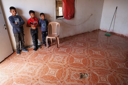 Children observe the hole in the floor caused by the projectile that fell during the Iranian attack, April 15.