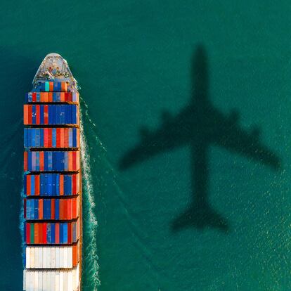 Experience the bustling activity of a thriving harbor with this aerial view of a cargo ship navigating through the sea. The expansive view showcases the maritime world in action, with the cargo ship gliding through the harbor against a backdrop of industry and trade. The bustling scene, filled with cargo containers, cranes, and maritime activity, epitomizes global commerce and transportation networks. This image perfectly conveys the vibrancy of international trade, logistics, and the interconnectedness of global economies. It's an ideal visual for projects portraying a thriving harbor's dynamic and vital essence.