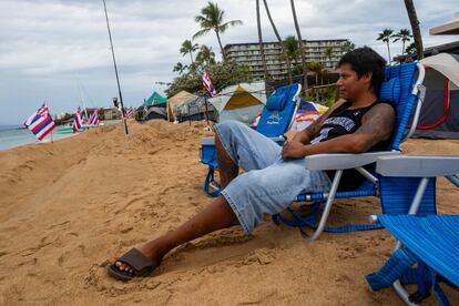 Carlos Lamas looks out to the sea from his spot at the "Fish-in" protest on, Friday, Dec. 1, 2023, in Lahaina, Hawaii.