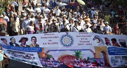 Self-defense groups march in La Ruana on February 24 to mark the movement's first anniversary.