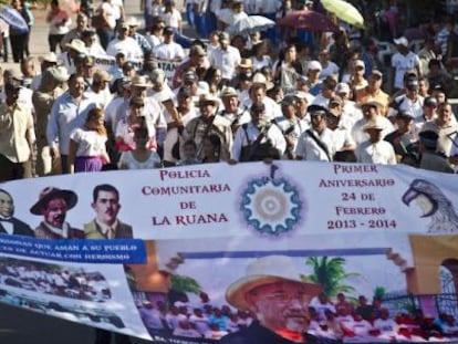 Self-defense groups march in La Ruana on February 24 to mark the movement's first anniversary.