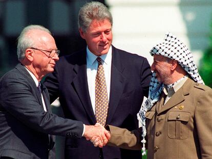 FILE - Israeli Prime Minister Yitzhak Rabin, left, and Palestinian leader Yasser Arafat shake hands marking the signing of the peace accord between Israel and the Palestinians, in Washington, Sept. 13, 1993. Israel's foreign minister told the Norwegian foreign minister Wednesday, Sept. 13, 2023 that Israel rejects “external dictates” on its handling of the Israeli-Palestinian conflict, according to a statement from his office. Foreign Minister Eli Cohen's statement comes on the 30th anniversary of the Oslo Accords, a peace agreement between Israel and Palestinian leaders which many view as the region's last gasp at peace. (AP Photo/Ron Edmonds, File)