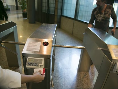 Workers sign in to the offices of public television station Telemadrid.