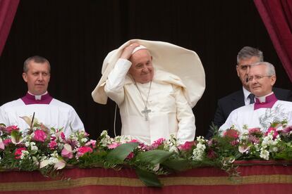 Pope Francis smiles from the central balcony of the St. Peter's Basilica prior to the 'Urbi et Orbi' (To the city and to the world) blessing, at the Vatican, Sunday, March 31, 2024.