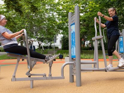 Two women exercise in a residential area of Dresden, Germany.