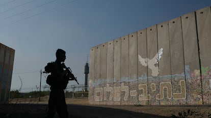 A security wall with Hebrew writing reading "Path to Peace" at the Kibbutz Netiv Haasara near the border with Gaza Strip.