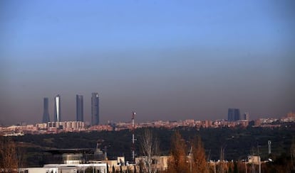 Pollution hanging over the city of Madrid, as seen from the A-6 freeway.