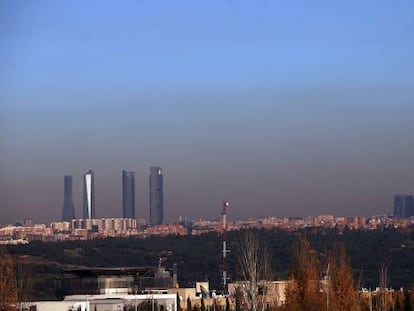 Pollution hanging over the city of Madrid, as seen from the A-6 freeway.