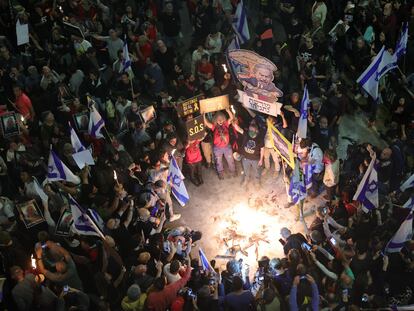 Hundreds of people protest in front of the Kirya military barracks in Tel Aviv on Saturday, April 6.