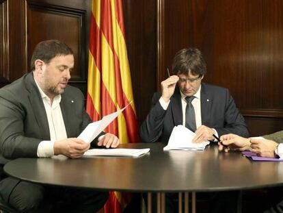 Junqueras, Puigdemont y un secretario del Tribunal Superior de Cataluña.