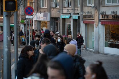 People wait in line for a Covid test outside a private clinic in Barcelona.