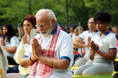 Indian Prime Minister Narendra Modi practices yoga with hundreds of people at the United Nations headquarters