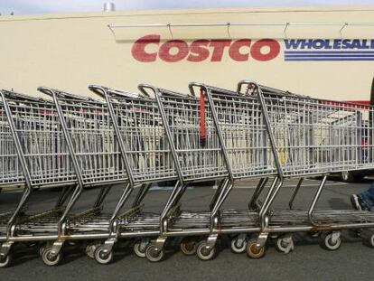 A Costco employee pulls shopping carts at a US branch of the store.