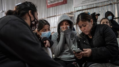 Latin American migrants watch the inauguration of U.S. President Trump at the Juventud 2000 shelter in Tijuana, Mexico.