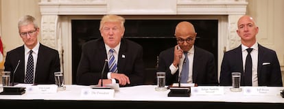 U.S. President Donald Trump (2nd L) welcomes members of his American Technology Council, including (L-R) Apple CEO Tim Cook, Microsoft CEO Satya Nadella and Amazon CEO Jeff Bezos in the State Dining Room of the White House June 19, 2017 in Washington, DC