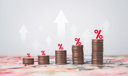 Coins stacking with white up arrow and percentage on international banknote for increasing Financial interest rate and inflation concept.