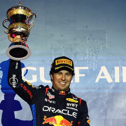 BAHRAIN, BAHRAIN - MARCH 02: Second placed Sergio Perez of Mexico and Oracle Red Bull Racing celebrates on the podium during the F1 Grand Prix of Bahrain at Bahrain International Circuit on March 02, 2024 in Bahrain, Bahrain. (Photo by Clive Rose/Getty Images)