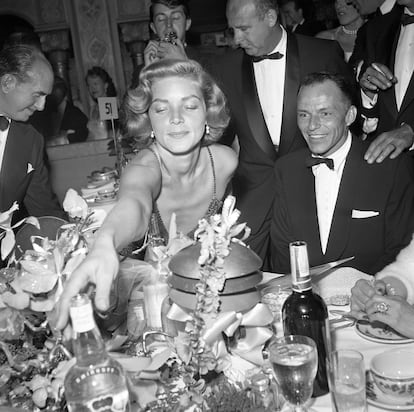 Lauren Bacall with a smiling Frank Sinatra in 1954. 