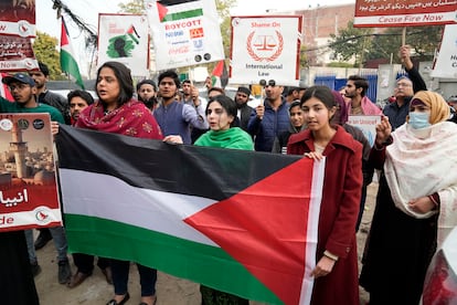 Pakistani people hold placards during a protest against Israeli airstrikes and to show solidarity with Palestinian people in Gaza, in Lahore, Pakistan, Saturday, Feb. 3, 2024.