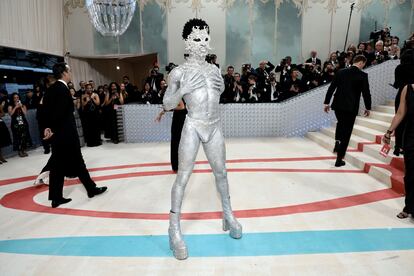 Lil Nas X at the Met Gala wearing body paint and a pearl emblazoned mask.