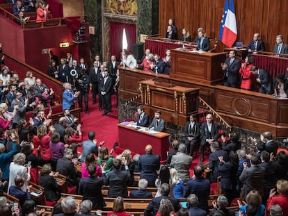 French members of the Parliament stand and applaud after approving a bill to enshrine women's right to abortion in the constitution, during a special congress gathering of both houses of parliament (National Assembly and Senate) in the palace of Versailles, outside Paris, France, March 4, 2024.