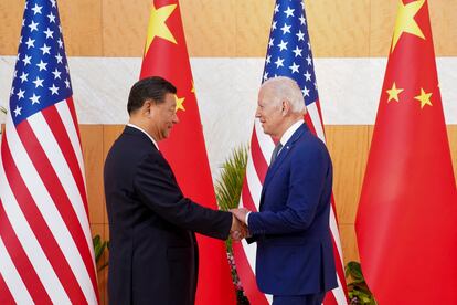 President Joe Biden shakes hands with Chinese President Xi Jinping