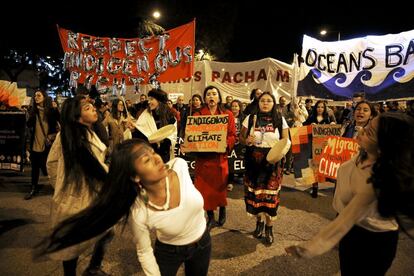 A group of Indigenous activists perform a dance at the climate change protest.