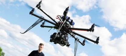 A technician flying a drone.