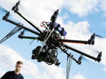 A technician flying a drone.