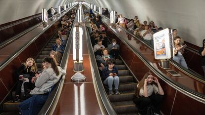 People take cover at a metro station during a Russian rocket attack in Kyiv, Ukraine, Monday, May 29, 2023.