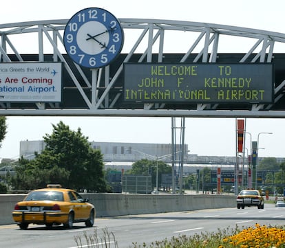 A clock at the entrance to JFK Airport in New York is pictured on Aug. 15, 2003.