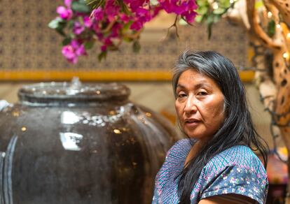 In this Monday, Jun. 25, 2018, photo, Odilia Romero, a trilingual interpreter in English, Spanish and her native Zapotec, a language from the Mexican state of Oaxaca, poses for a photo at Oaxacan restaurant, La Guelaguetza in Los Angeles. Romero is working to put together interpretation teams who can help attorneys and officials communicate with non-Spanish-speaking indigenous children and their detained parents in an effort to ensure their legal, medical and other needs are met and that they understand immigration proceedings.   (AP Photo/Damian Dovarganes)