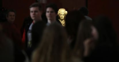 The famous 'Lady of Elche,' surrounded by visitors at the National Archeology Museum in Madrid.