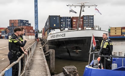 A boat patrols the harbor in Rotterdam.