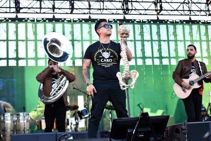 Regulo Caro, with a skull-shaped microphone in Long Beach, California, in 2018.