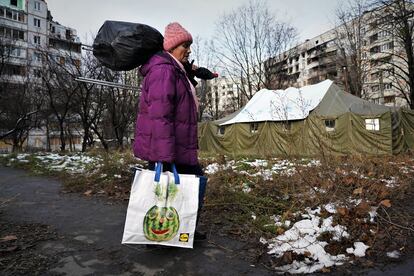 Tatiana, 72, in front of the shelter set up in Saltivka.