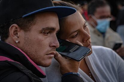 Dozens of South and Central American migrants wait outside the National Institute of Migration for reports of the 29 migrants injured and 38 killed during fire on March 30, 2023