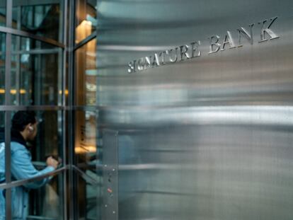 A person walks into the lobby of the Signature Bank headquarters, in New York City on March 13, 2023.